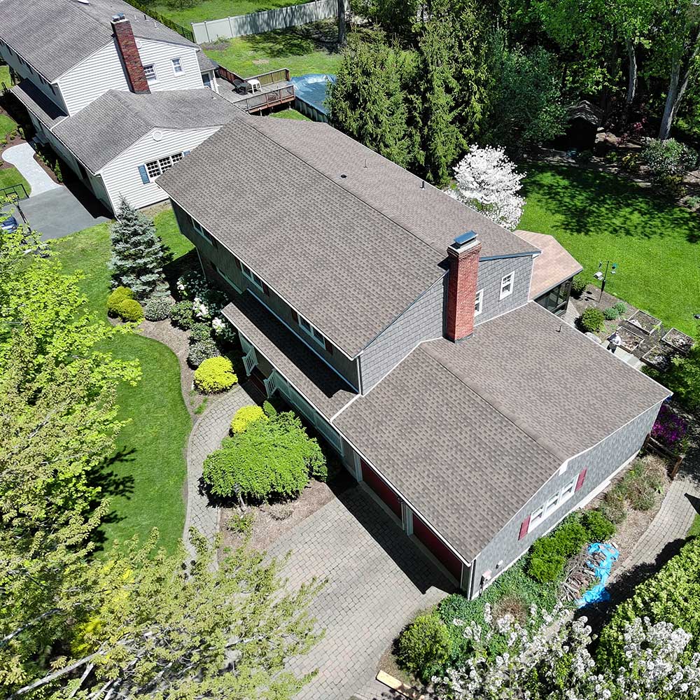 Asphalt Shingle Roofers Put Shingles on a Home in Ramsey, NJ
